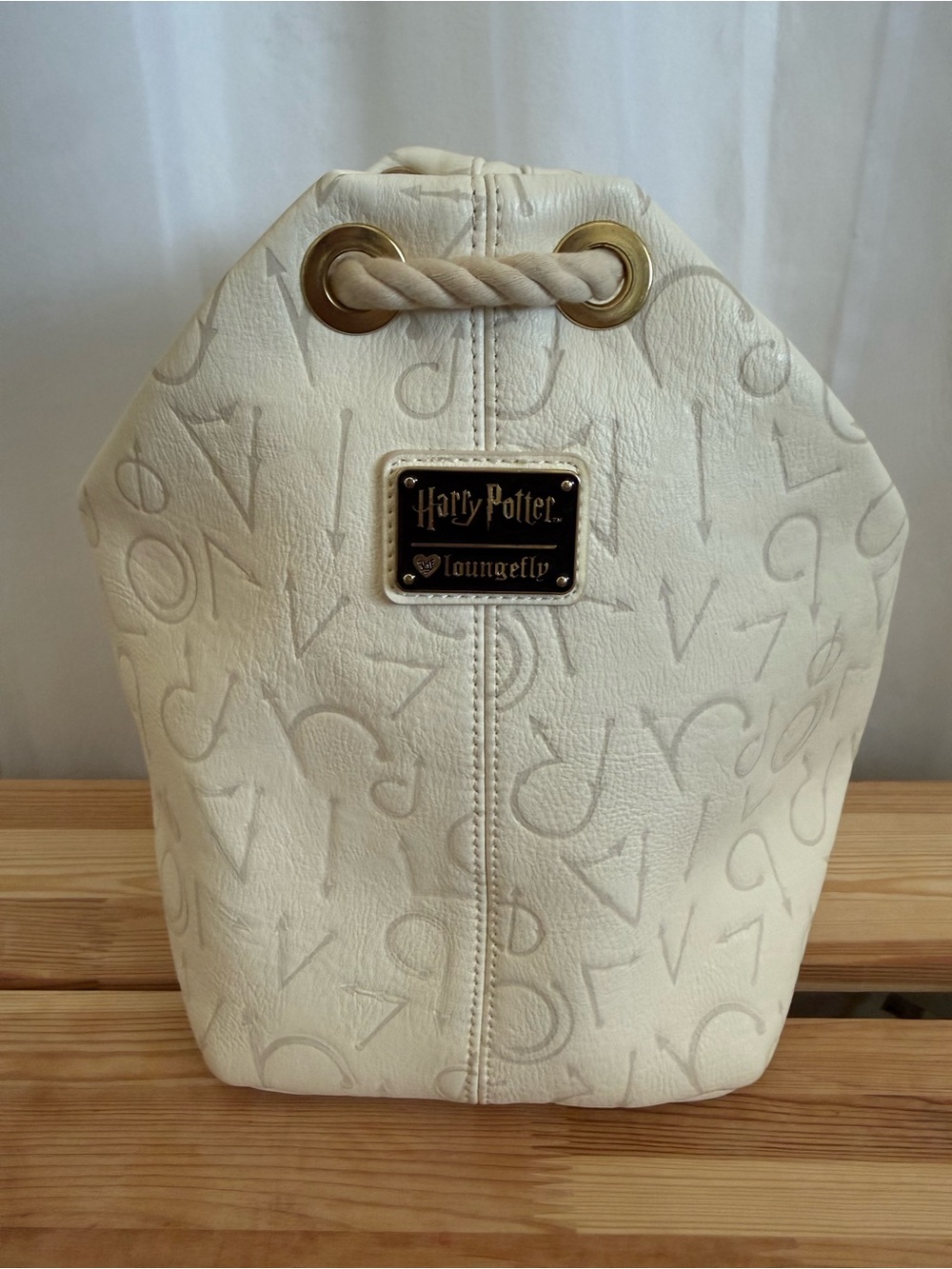 Warner Bros. Harry Potter Cream Drawstring Backpack with Gold Hardware Loungefly